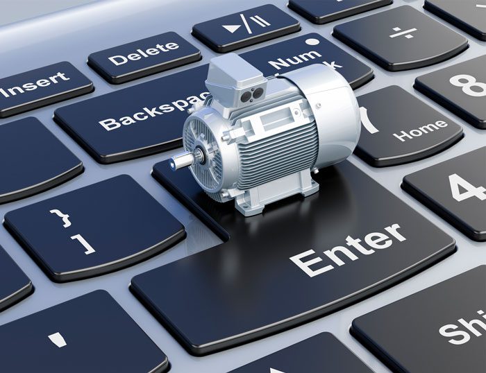 A small electric motor model on a computer keyboard's Enter key.