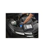 A mechanic using a diagnostic tablet on a car engine.